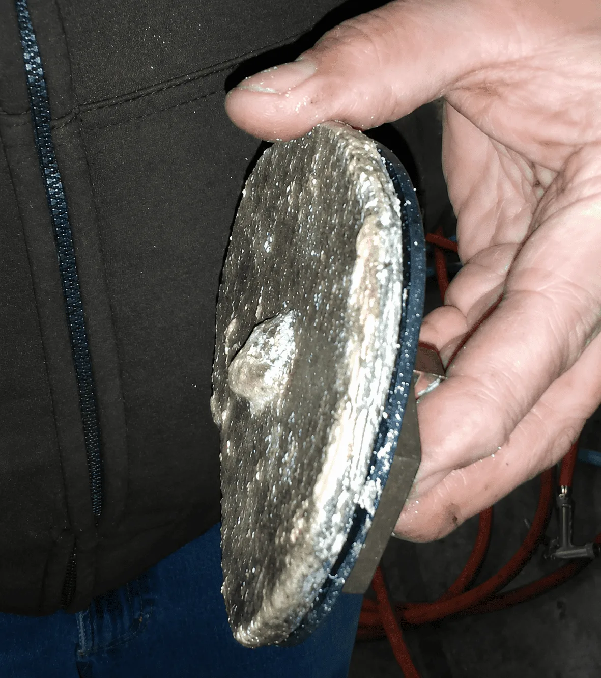 Water heater disc encrusted with a thick crust of limescale before QEQI® treatment — apple packing facility, US Northwest