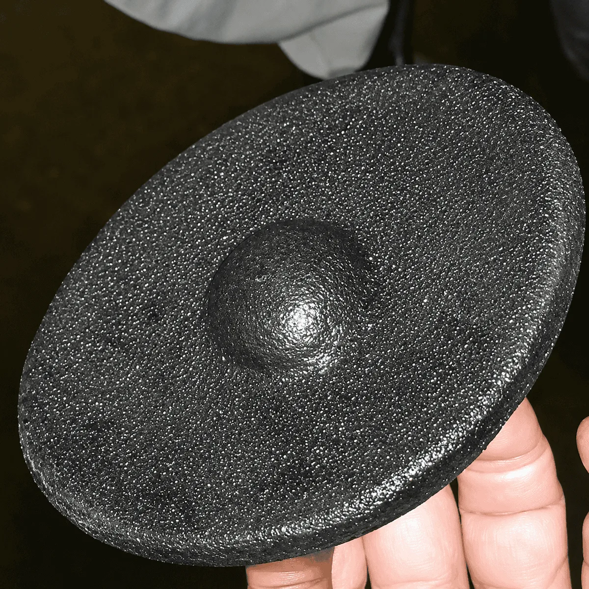 The same water heater disc free of limescale, back to clean bare metal, after QEQI® treatment — apple packing facility, US Northwest