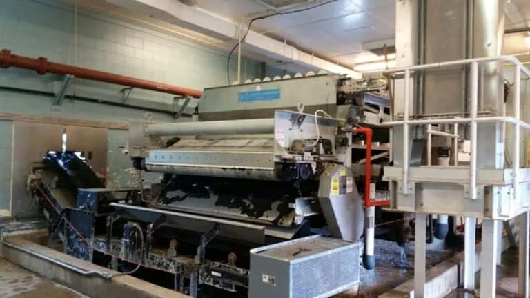 Belt filter press at the City of London wastewater treatment plant, Ohio, QEQI® struvite deposit removal case study