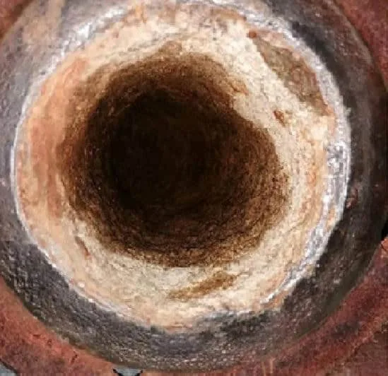 Hard calcite scale and biofouling in the cooling water circuit before QEQI® treatment — Zaporizhzhya Nuclear Power Plant, Ukraine