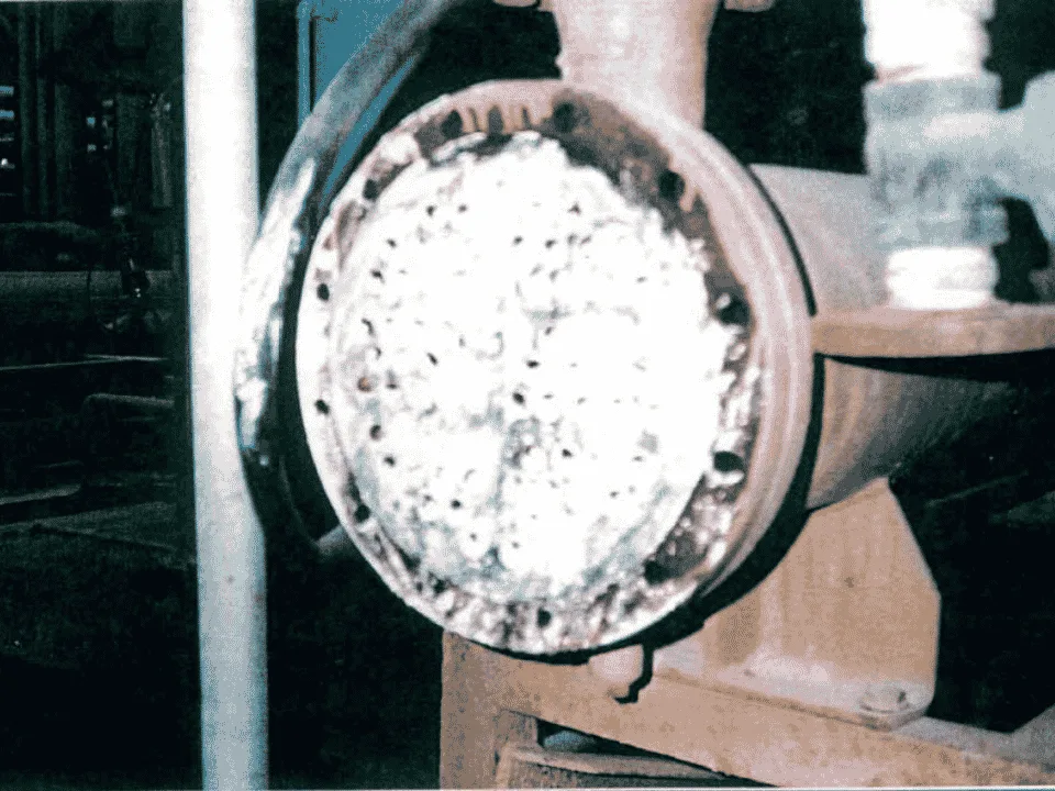 Shell-and-tube heat exchanger tube sheet blocked with limescale before QEQI® treatment
